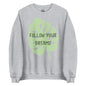 The 'Follow Your Dreams' classic sweatshirt shown in light grey, with the motivational slogan printed in a white script and sans-serif font across the chest.